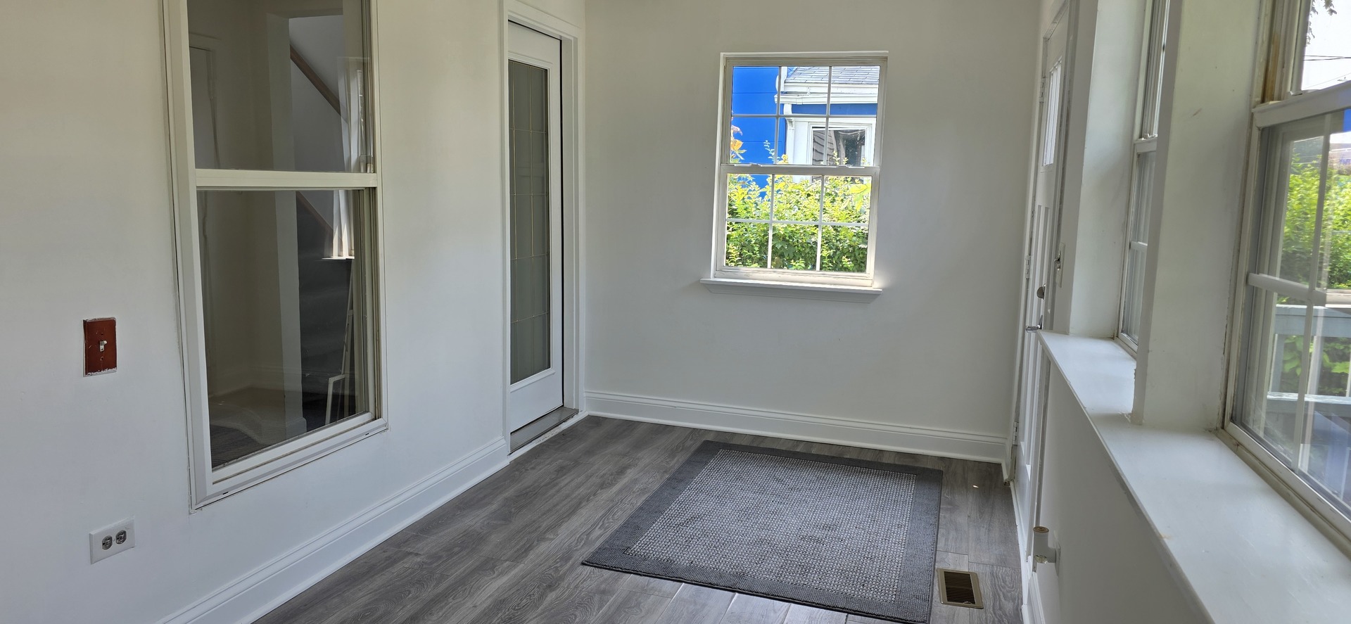 309 Griswold Street Elgin, IL 60123 - Photo 6 of 39 a view of an empty room with a window