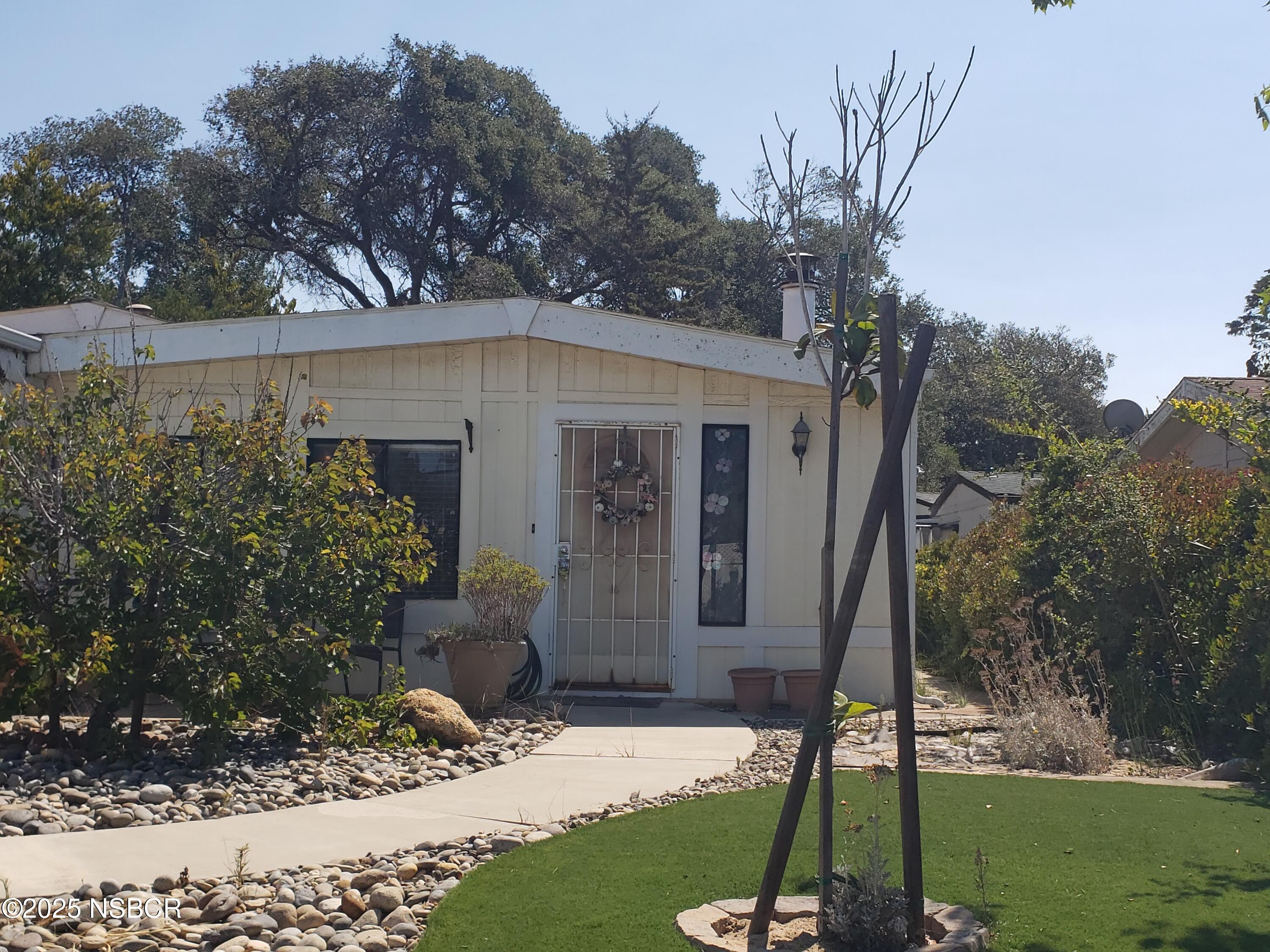 3822 Cherry Hill Road Santa Maria, CA 93455 - Photo 2 of 22 a front view of a house with garden