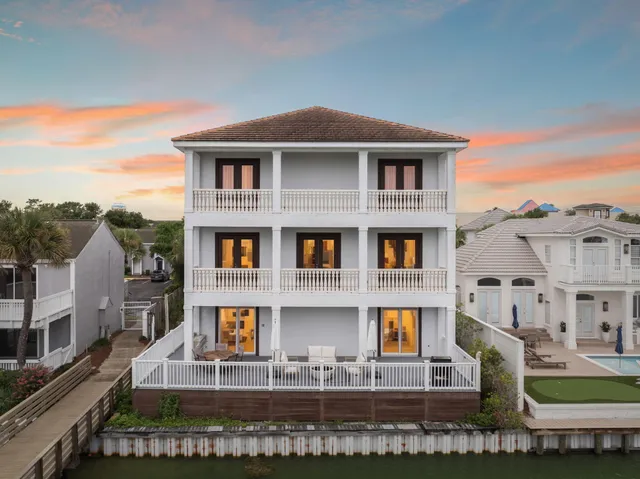 a front view of a residential apartment building with a yard