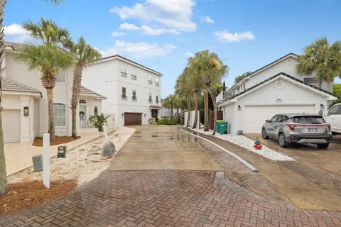 a large kitchen with stainless steel appliances and a refrigerator