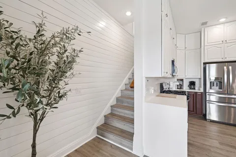 a bedroom with a large bed and a flat screen tv