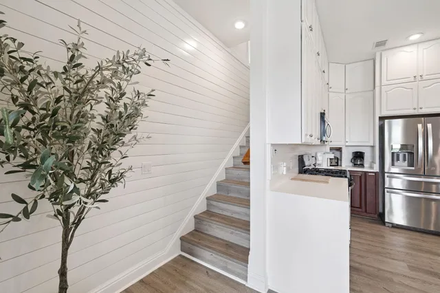 a bedroom with a large bed and a flat screen tv