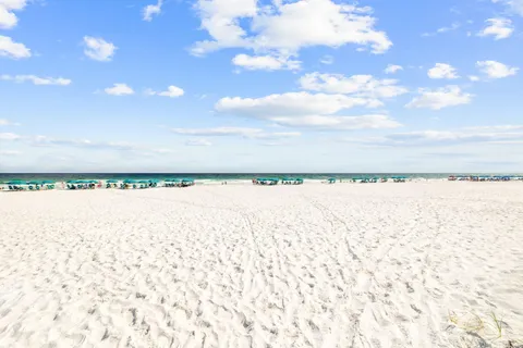 a view of a pathway of a house with wooden fence