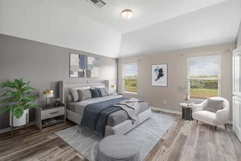 a bedroom with a bed and window