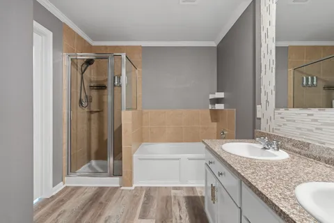 a bathroom with a tub and shower