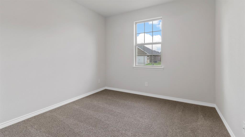 510 Range Road Caddo Mills, TX 75135 - Photo 8 of 25 Carpeted empty room with baseboards