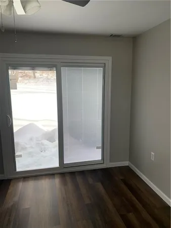 a view of lot of window with wooden floor
