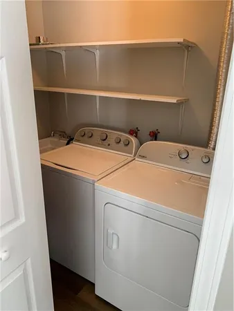 a utility room with dryer and washer