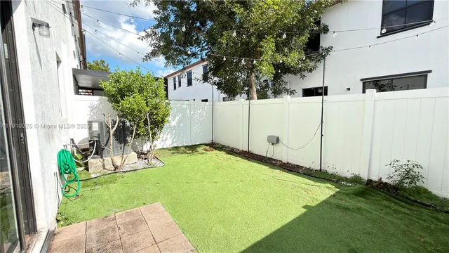 a view of a backyard with plants