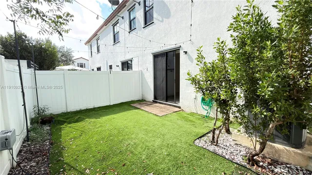 a view of a back yard of the house
