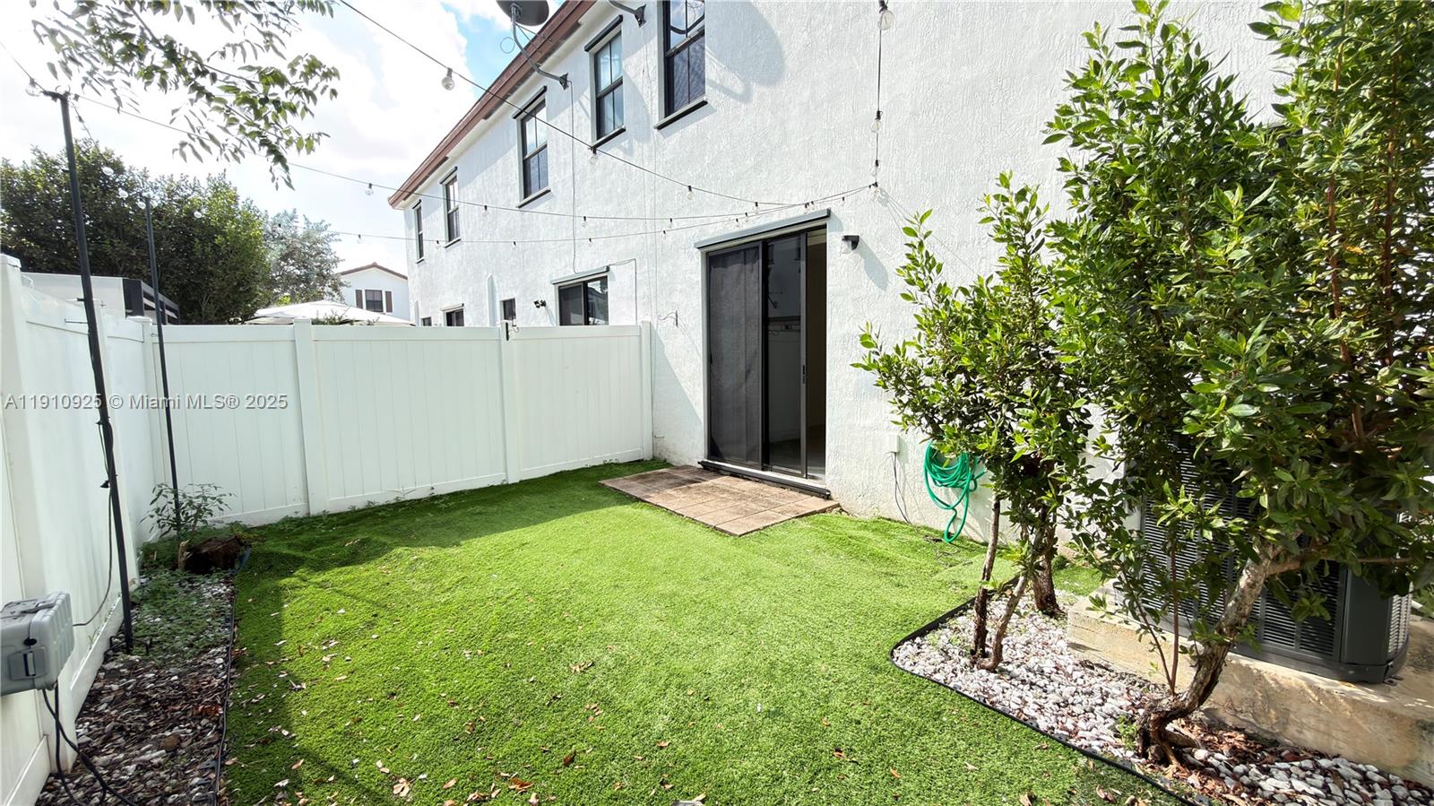 10337 West 34th Lane, Unit 10337 Hialeah, FL 33018 - Photo 20 of 50 a view of a back yard of the house