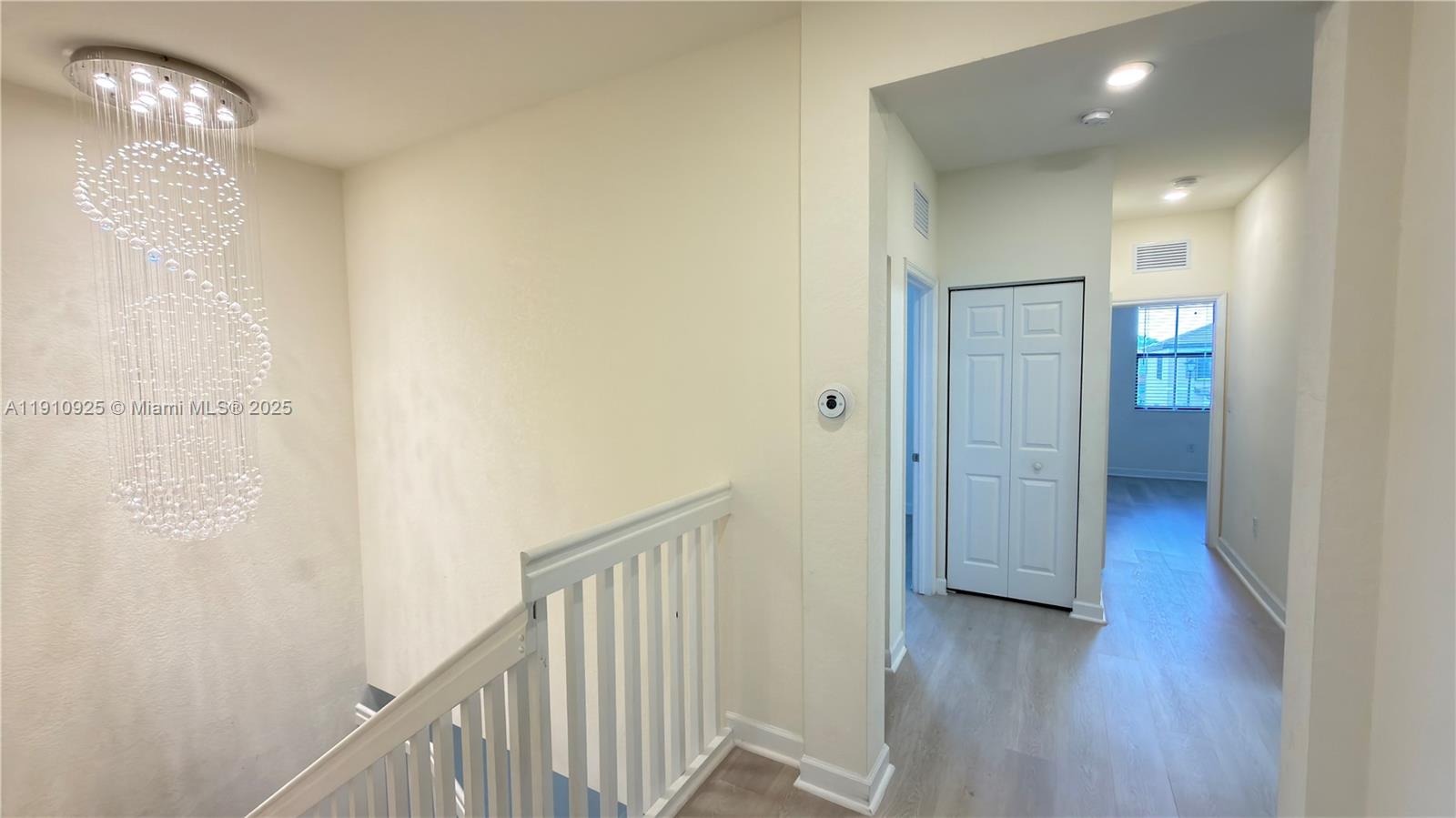 10337 West 34th Lane, Unit 10337 Hialeah, FL 33018 - Photo 24 of 50 a view of a hallway with wooden floor