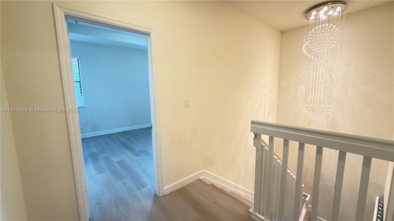 10337 West 34th Lane, Unit 10337 Hialeah, FL 33018 - Photo 26 of 50 a view of a hallway with wooden floor