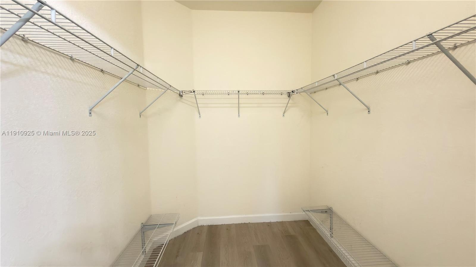 10337 West 34th Lane, Unit 10337 Hialeah, FL 33018 - Photo 33 of 50 a small space with a white wall and a window