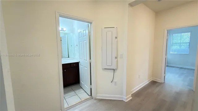 a view of a bathroom with a glass door