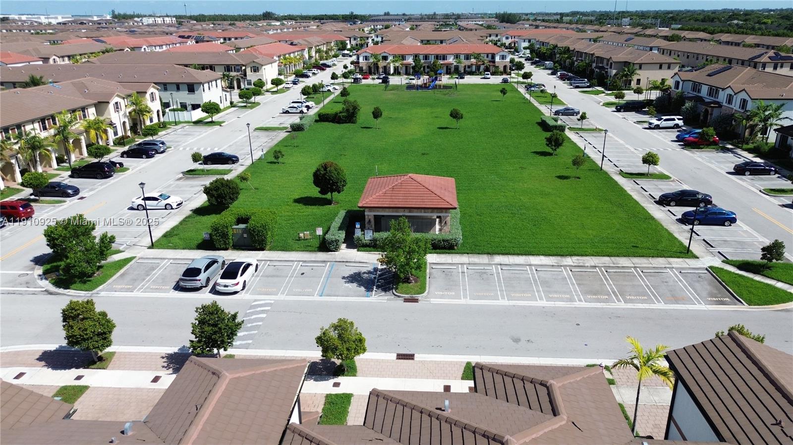 10337 West 34th Lane, Unit 10337 Hialeah, FL 33018 - Photo 41 of 50 an aerial view of residential houses with outdoor space and parking