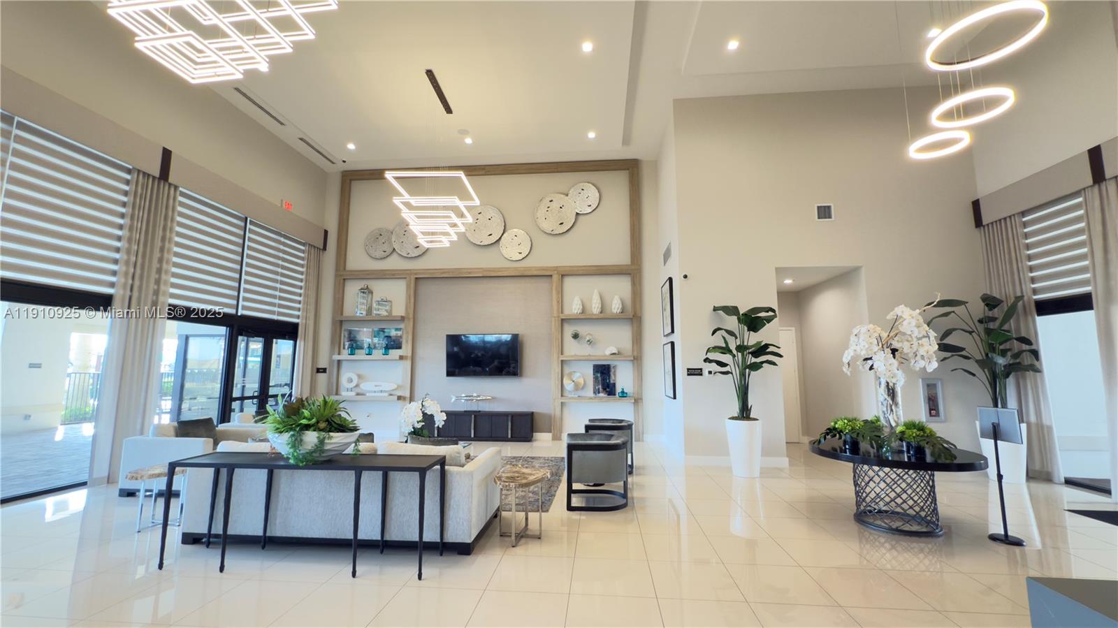 10337 West 34th Lane, Unit 10337 Hialeah, FL 33018 - Photo 42 of 50 a living room with furniture and a flat screen tv