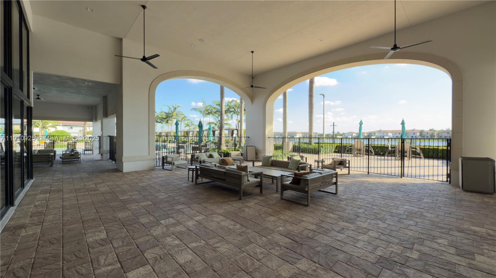 10337 West 34th Lane, Unit 10337 Hialeah, FL 33018 - Photo 44 of 50 a very nice looking living room with a large window and dining table