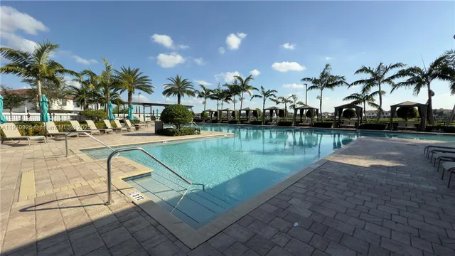 a view of swimming pool from a balcony