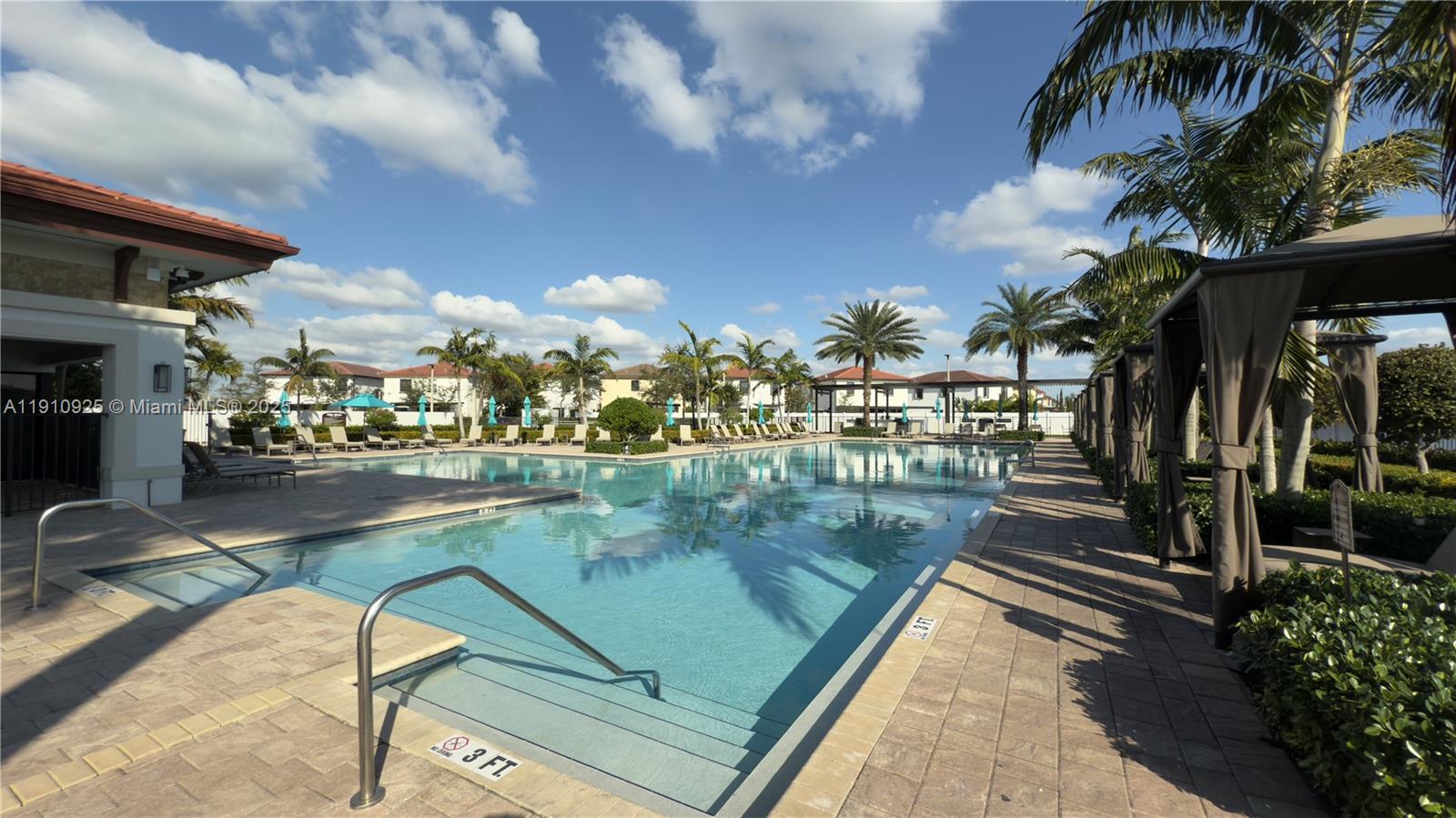 10337 West 34th Lane, Unit 10337 Hialeah, FL 33018 - Photo 46 of 50 a view of swimming pool from a balcony