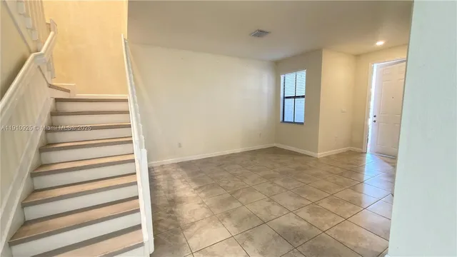 a view of entryway with stairs