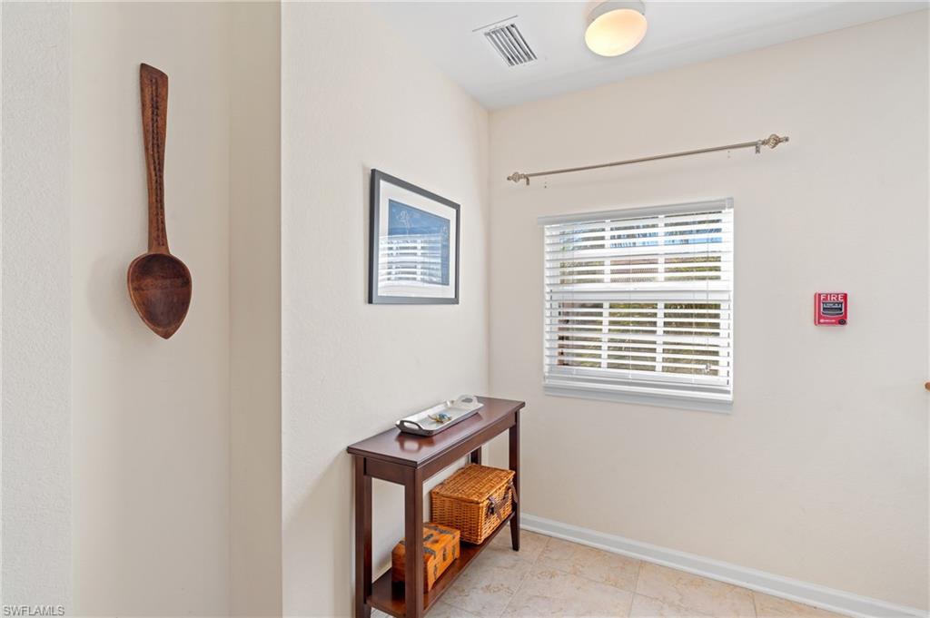 10057 Via Colomba Circle, Unit 206 Fort Myers, FL 33966 - Photo 11 of 46 a room with a desk and a window