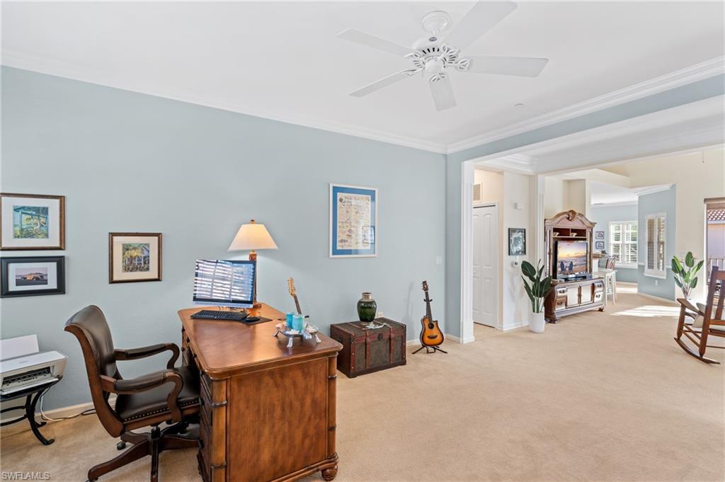 10057 Via Colomba Circle, Unit 206 Fort Myers, FL 33966 - Photo 18 of 46 a view of a workspace with furniture and a livingroom