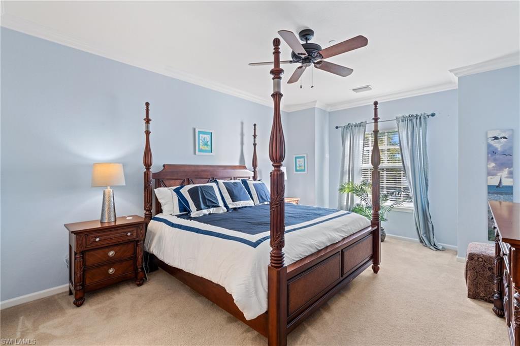 10057 Via Colomba Circle, Unit 206 Fort Myers, FL 33966 - Photo 26 of 46 a bed room with a bed and a ceiling fan