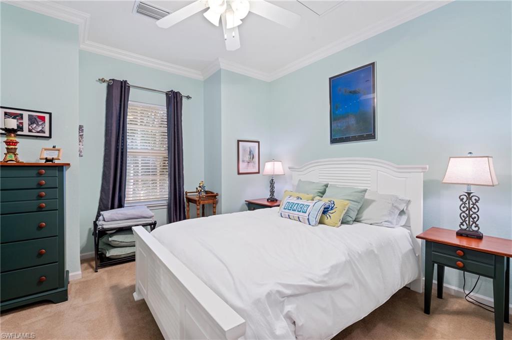 10057 Via Colomba Circle, Unit 206 Fort Myers, FL 33966 - Photo 34 of 46 a bedroom with a bed and a dresser