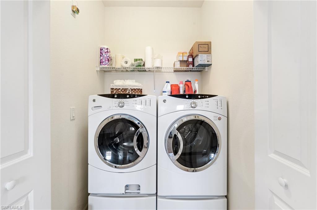 10057 Via Colomba Circle, Unit 206 Fort Myers, FL 33966 - Photo 39 of 46 a utility room with dryer and washer