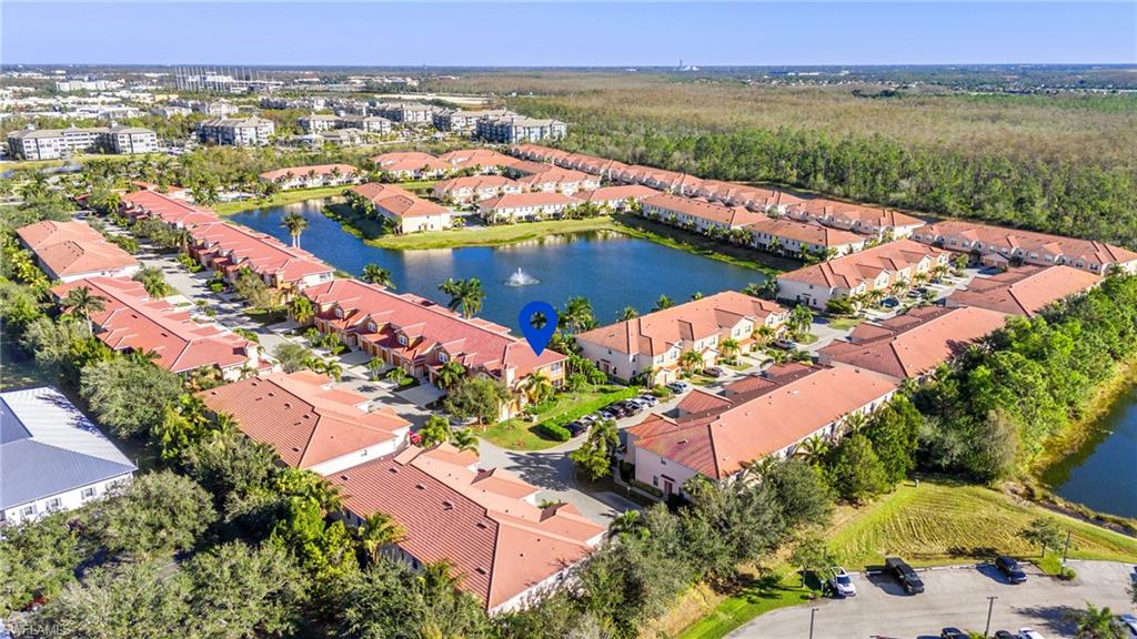 10057 Via Colomba Circle, Unit 206 Fort Myers, FL 33966 - Photo 4 of 46 an aerial view of residential houses with outdoor space