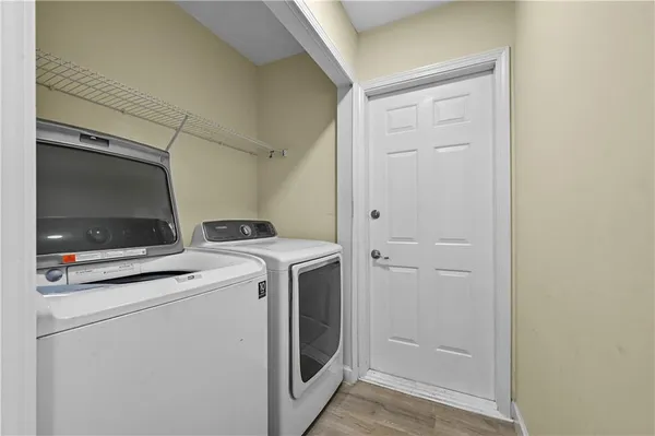a view of storage and utility room with washer and dryer