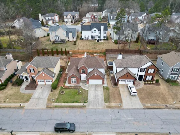 an aerial view of residential houses with outdoor space