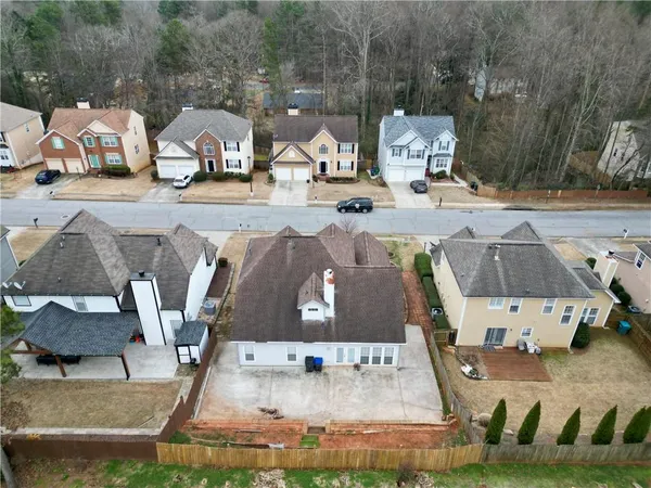 an aerial view of a house with a swimming pool