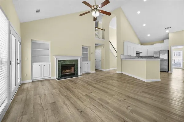 a view of a kitchen with furniture and a fireplace