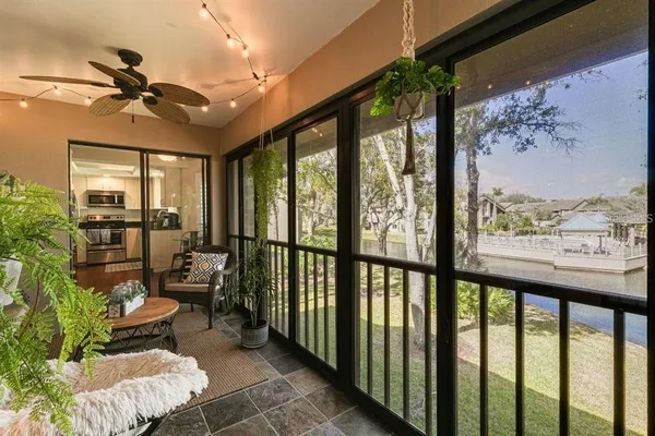 a view of a porch with furniture and a flat screen tv