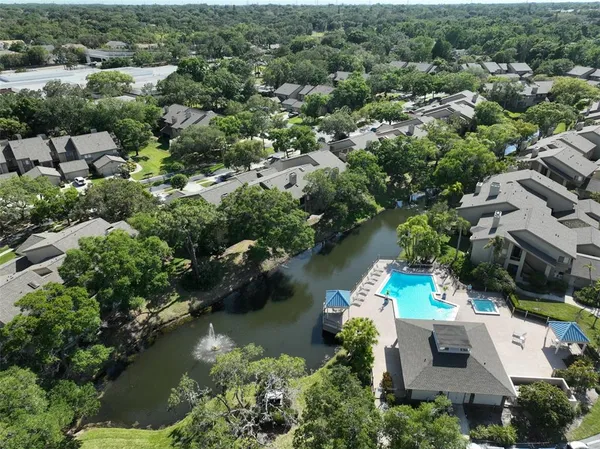 an aerial view of beach and residential houses with outdoor space