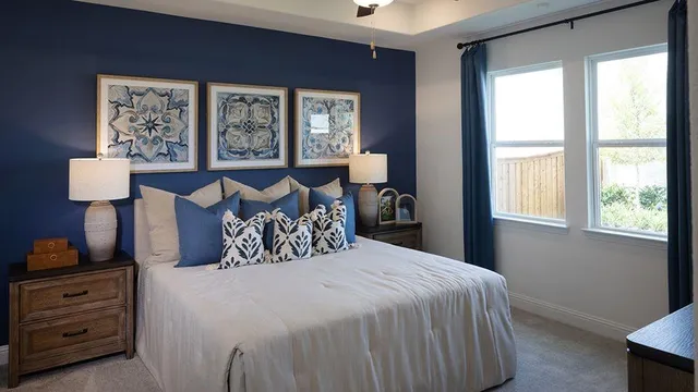 a bedroom with a bed and a painting on the wall