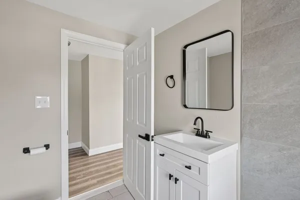 a bathroom with a sink and a mirror