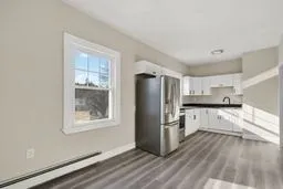 a kitchen with stainless steel appliances a refrigerator and a stove top oven