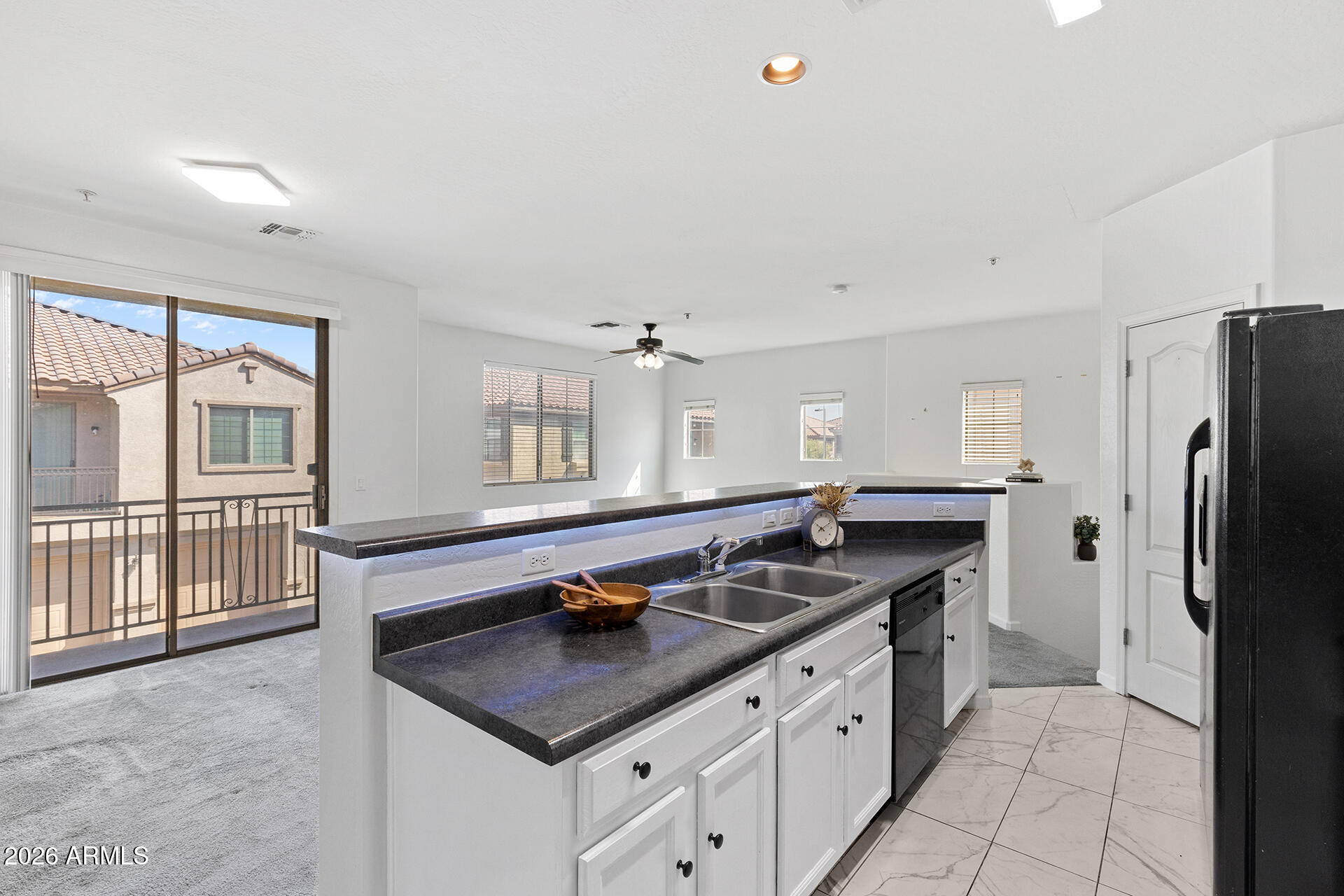 8189 West Groom Creek Road Phoenix, AZ 85043 - Photo 18 of 37 a kitchen with stainless steel appliances granite countertop a sink stove and refrigerator