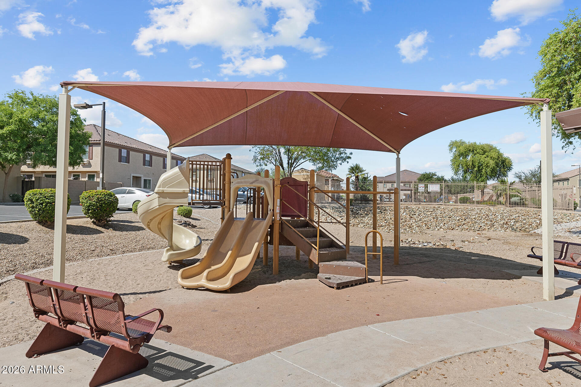 8189 West Groom Creek Road Phoenix, AZ 85043 - Photo 33 of 37 a view of a patio with a table and chairs under an umbrella