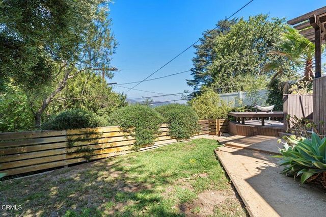 a view of a backyard with sitting area
