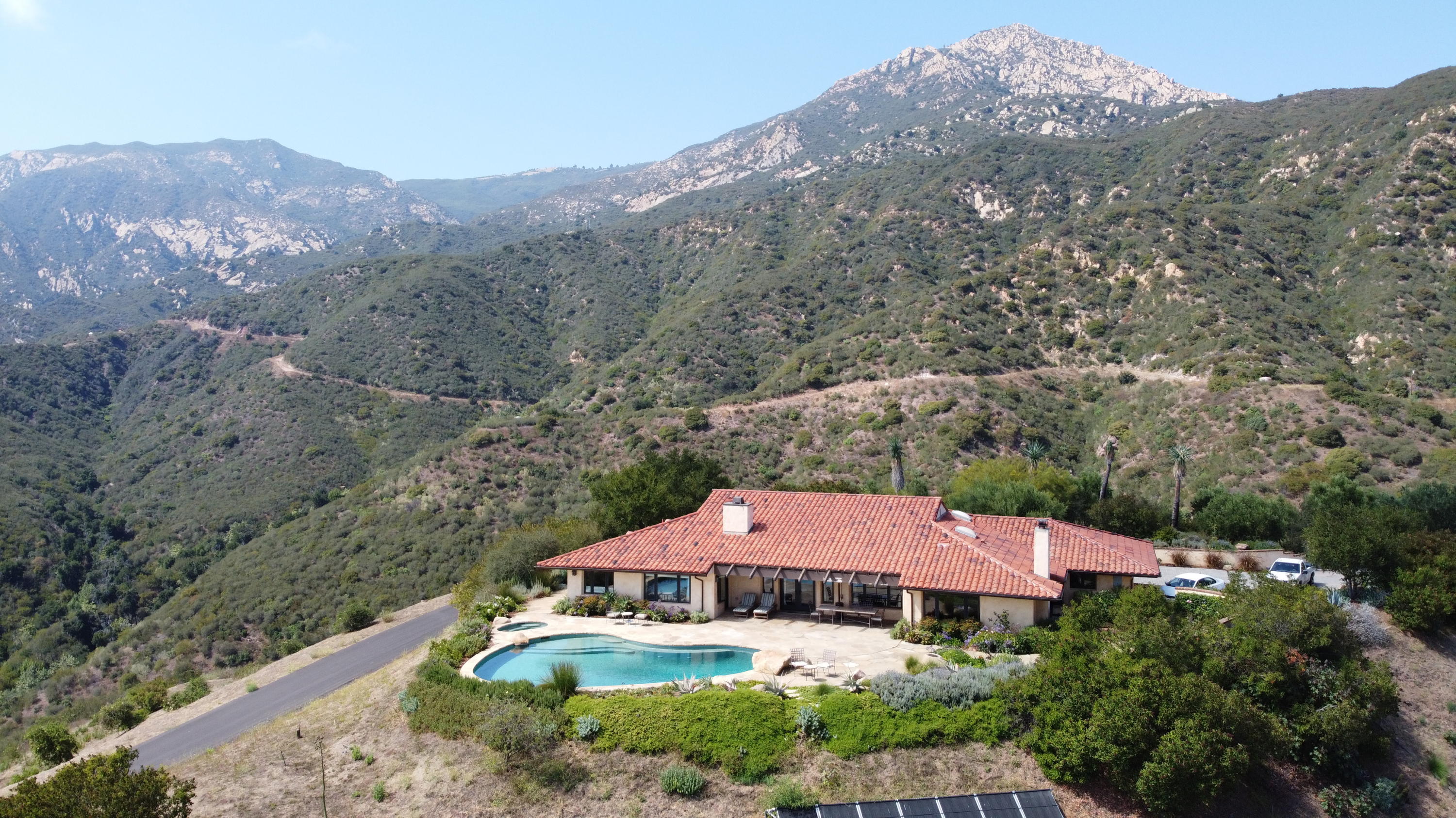 2885 Spyglass Ridge Road Santa Barbara, CA 93105 - Photo 1 of 1 an aerial view of a house with a mountain in the background