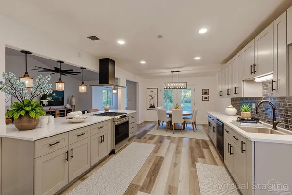 a kitchen with a sink stove and cabinets