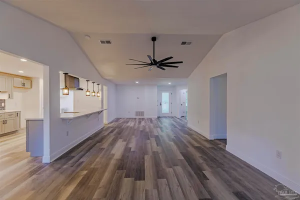 a view of gallery with wooden floor