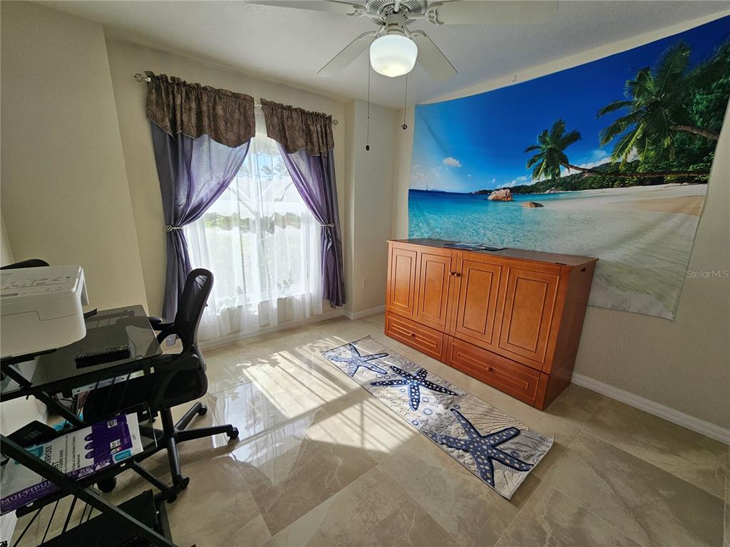 114 Albatross Road Rotonda West, FL 33947 - Photo 26 of 36 a workspace with furniture and window