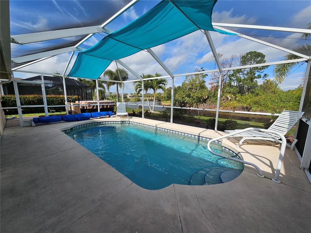 114 Albatross Road Rotonda West, FL 33947 - Photo 31 of 36 a view of a swimming pool with a patio
