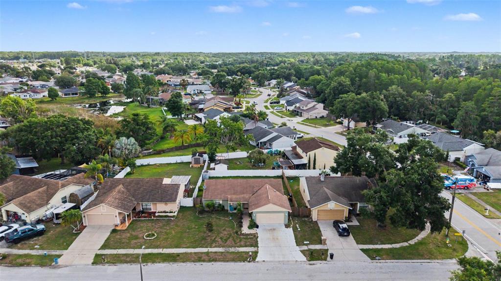 1632 Pintail Court Lutz, FL 33549 - Photo 30 of 34 an aerial view of residential houses with outdoor space and street view