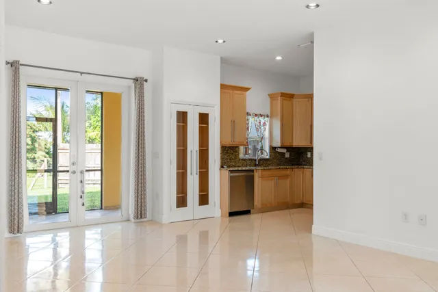 a kitchen with stainless steel appliances a refrigerator and a sink